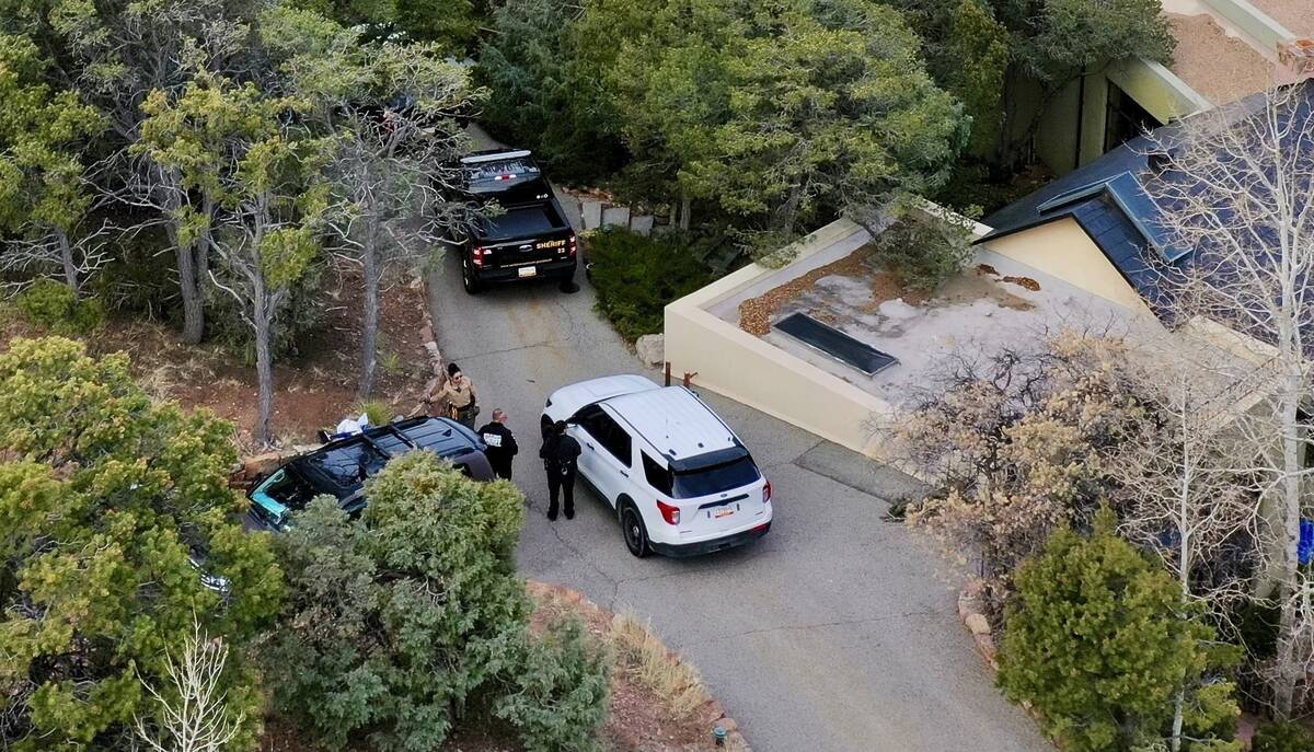 Law enforcement officials talk outside the home of actor Gene Hackman on Feb. 27, 2025 in Santa ...