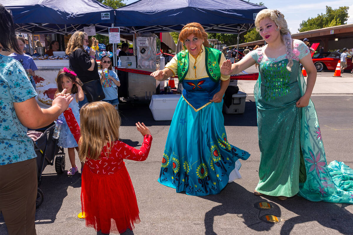 Characters greet attendees as they wander the event during the Spring Jamboree outdoor festival ...