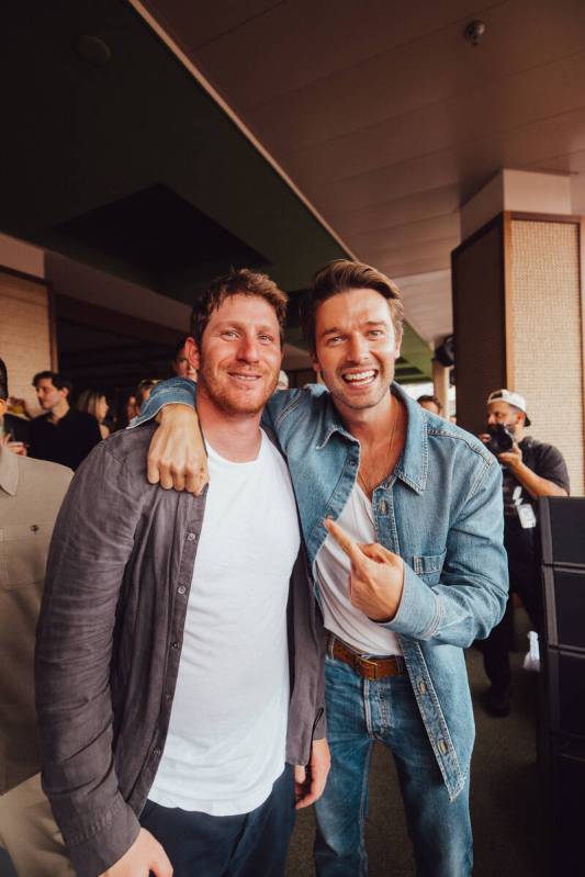 Myles Shear is shown with Patrick Schwarzenegger at the opening of Palm Tree Beach Club at MGM ...