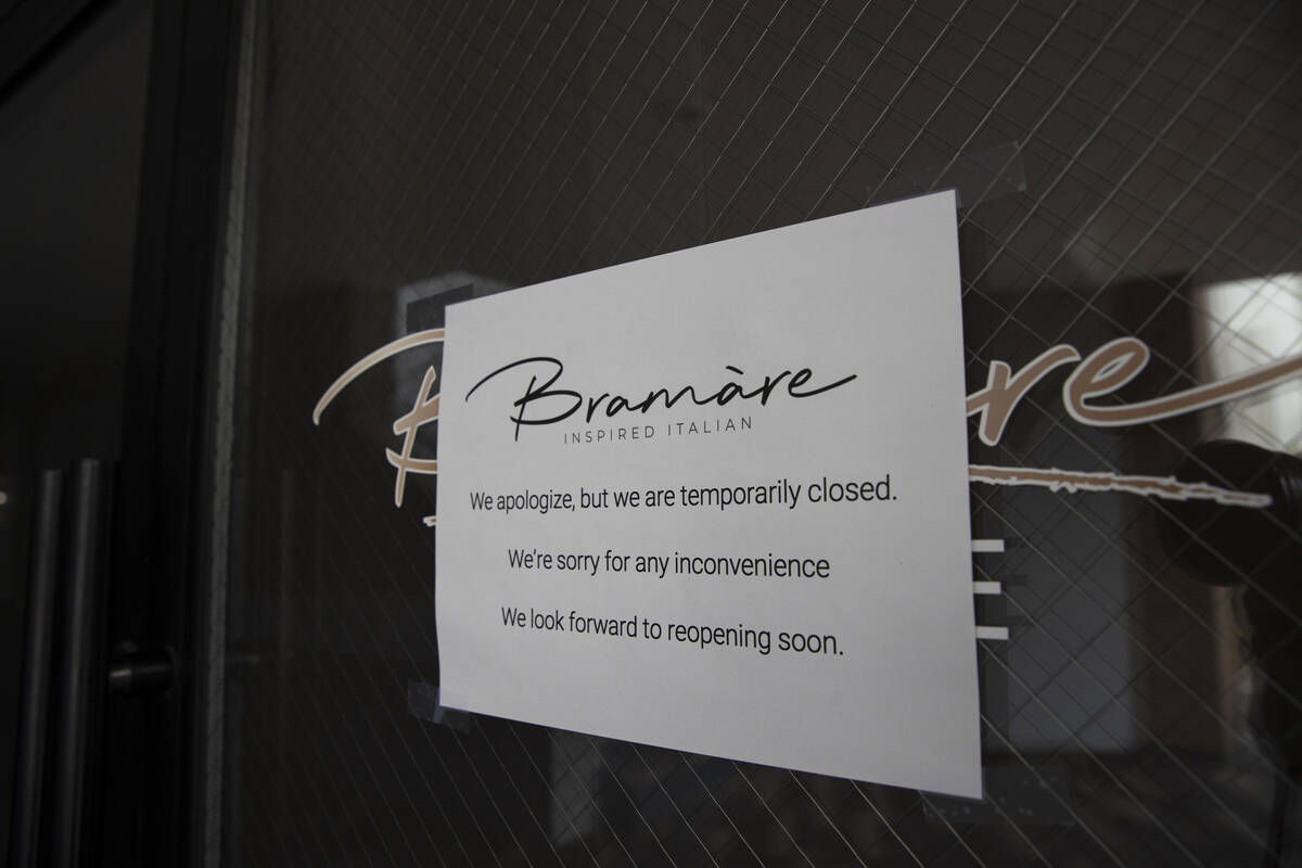 A sign noting a temporary closure at talian restaurant Bramàre is seen on Tuesday, May 6, ...