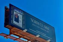 A billboard from Elite Media honoring the late Review-Journal columnist Norm Clarke is shown ab ...