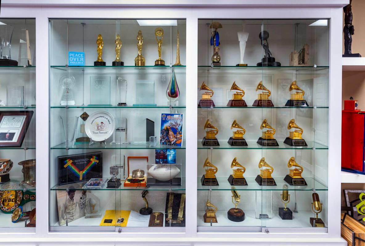 A cabinet full of Carlos Santana’s awards and memorabilia at his office on Wednesday, Apr ...