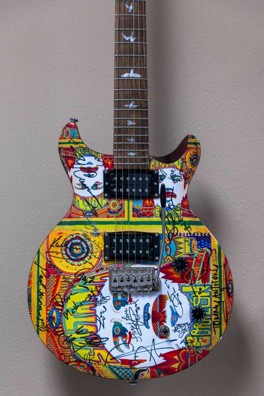 An autographed guitar hanging on the wall of Carlos Santana’s office on Wednesday, April ...