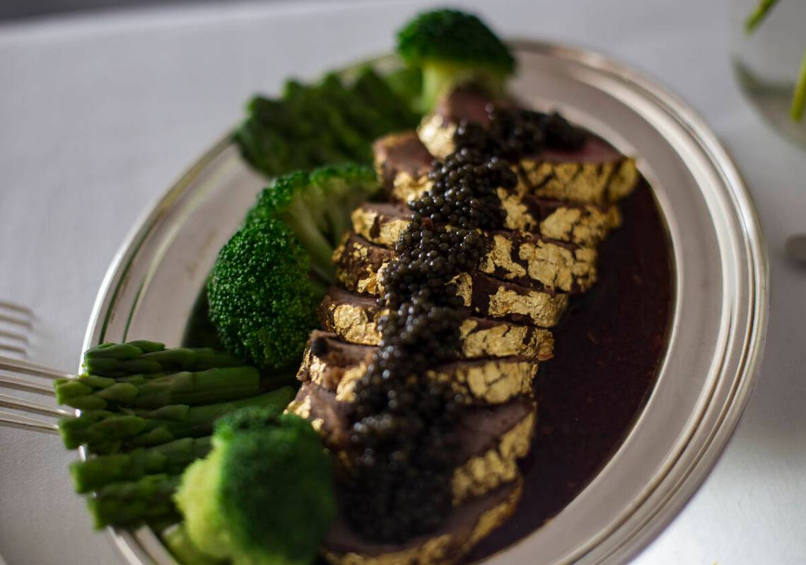The gold-encrusted filet mignon, from Mr. Chow at Ceasars Palace on the Las Vegas Strip, is see ...