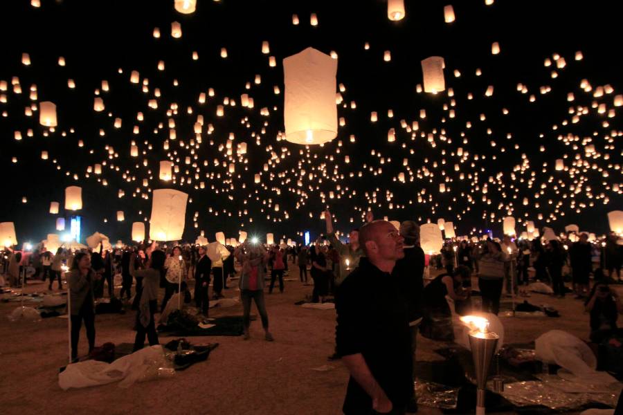 Paper lanterns are released and float to the sky at the RiSE Festival Saturday, Oct. 18, 2014, ...