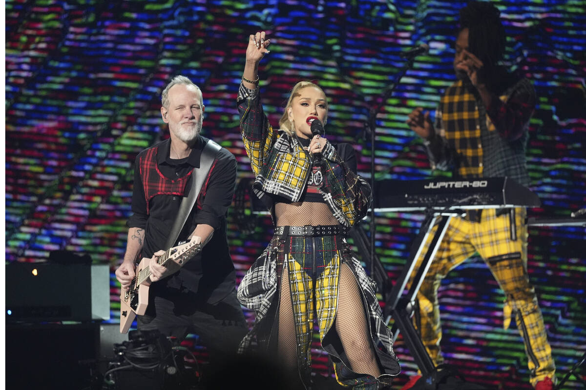 Tom Dumont, left, and Gwen Stefani of No Doubt perform during the FireAid benefit concert on Th ...