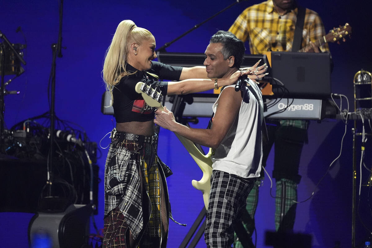 Gwen Stefani, left, and Tony Kanal of No Doubt perform during the FireAid benefit concert on Th ...