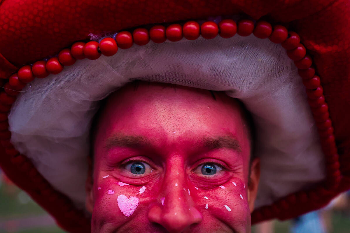 A festival goer who declined to give their name shows off their makeup during day one of the El ...