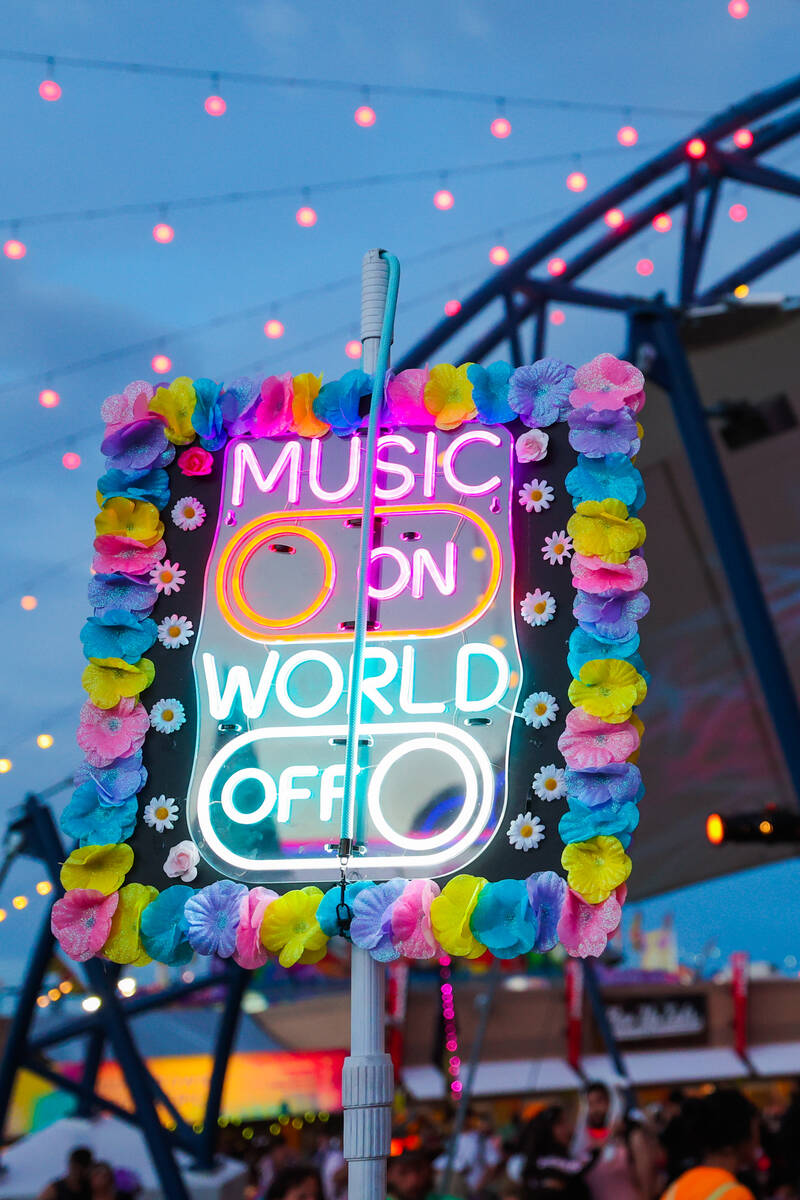A festival attendee holds up a sign during day one of the Electric Daisy Carnival festival at t ...