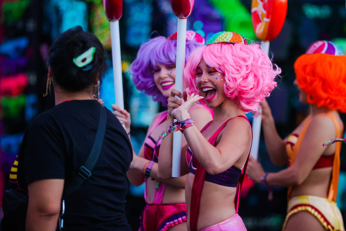 Performers greet festival attendees during day one of the Electric Daisy Carnival festival at t ...