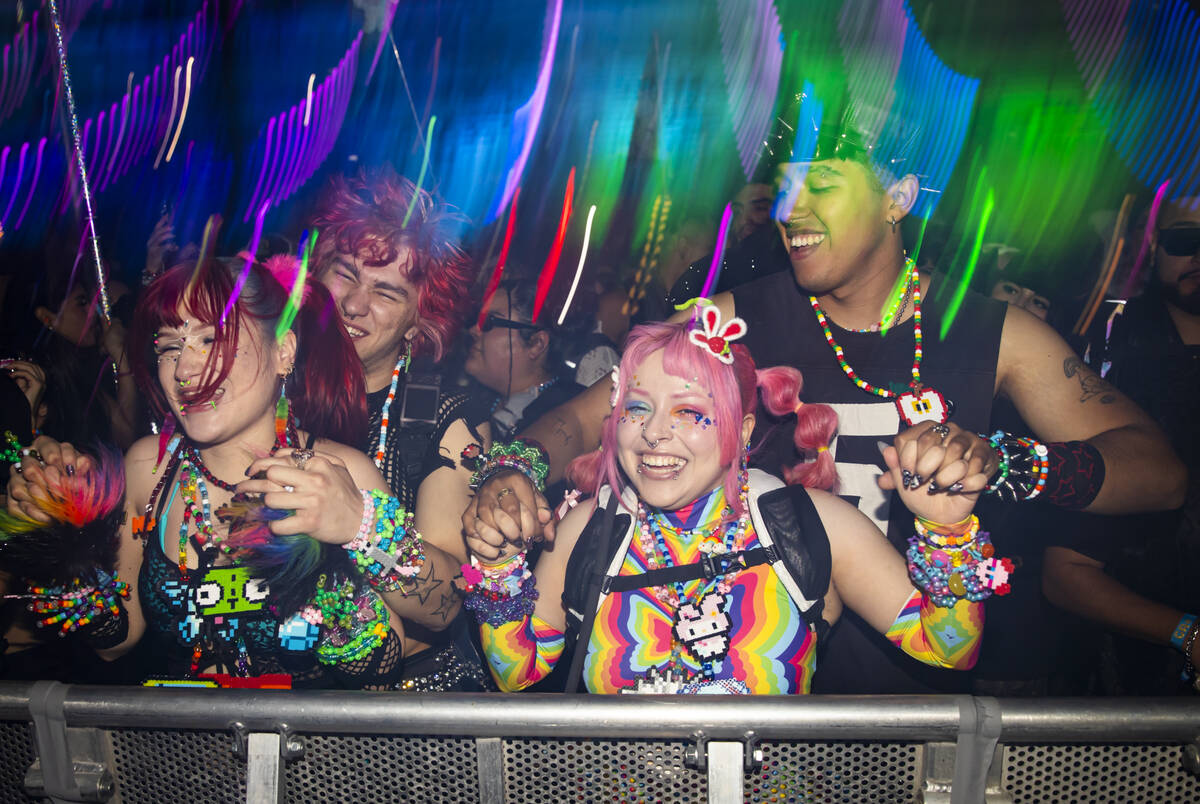 People dance as Brutalismus 3000 performs at the Cosmic Meadow stage during the second night of ...