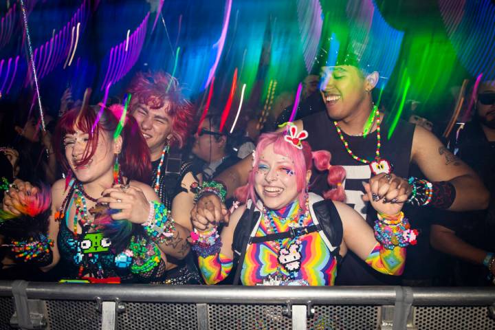 People dance as Brutalismus 3000 performs at the Cosmic Meadow stage during the second night of ...