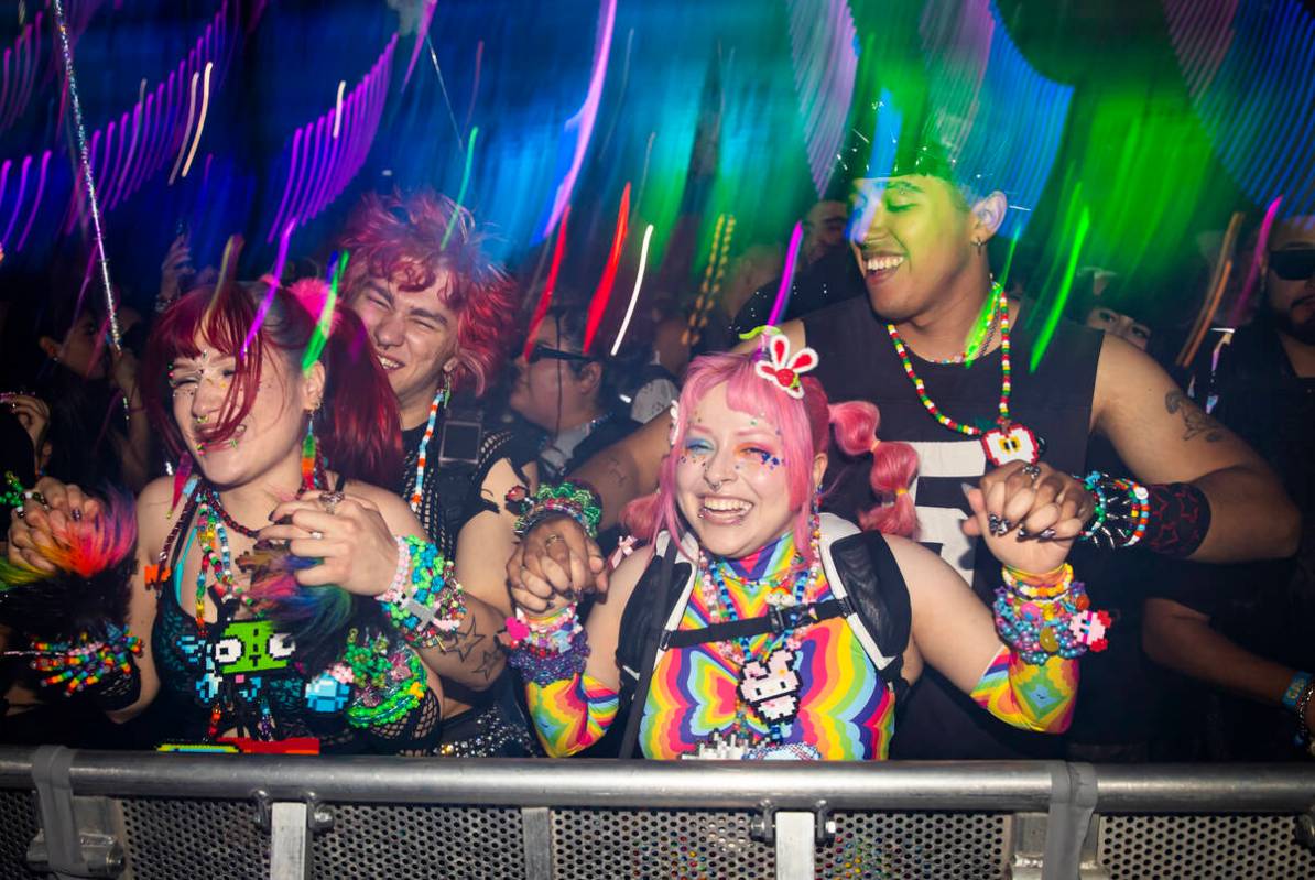 People dance as Brutalismus 3000 performs at the Cosmic Meadow stage during the second night of ...