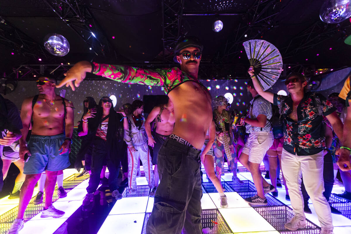 Estevan Velasco, of Las Vegas, dances during the final night of the Electric Daisy Carnival at ...