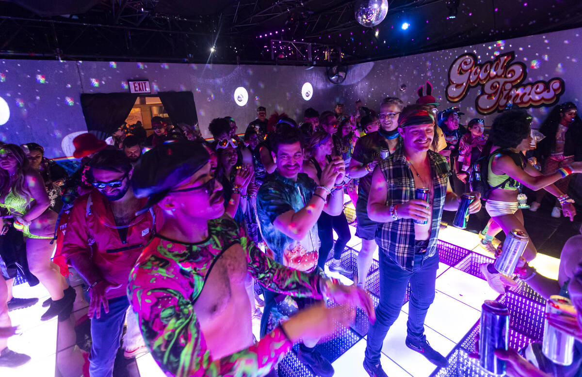 Attendees dance during the final night of the Electric Daisy Carnival at Las Vegas Motor Speedw ...