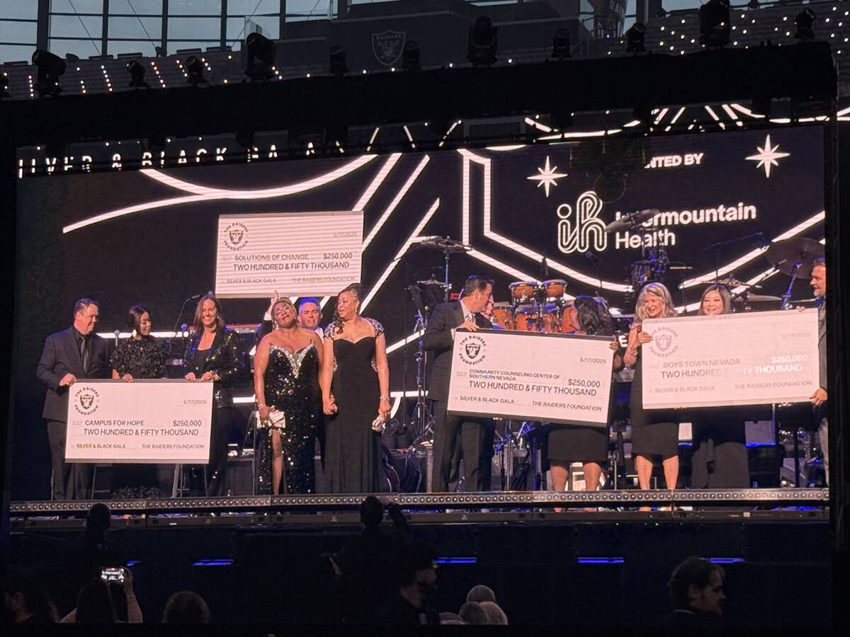Donation checks are shown at the second annual Raiders Silver & Black Gala at Allegiant Stadium ...