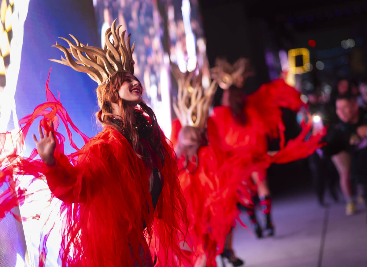 Costumed performers dance during the second night of the Electric Daisy Carnival at Las Vegas M ...