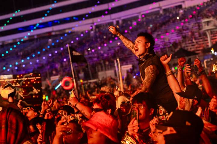 People cheer as Brutalismus 3000 performs at the Cosmic Meadow stage during the second night of ...