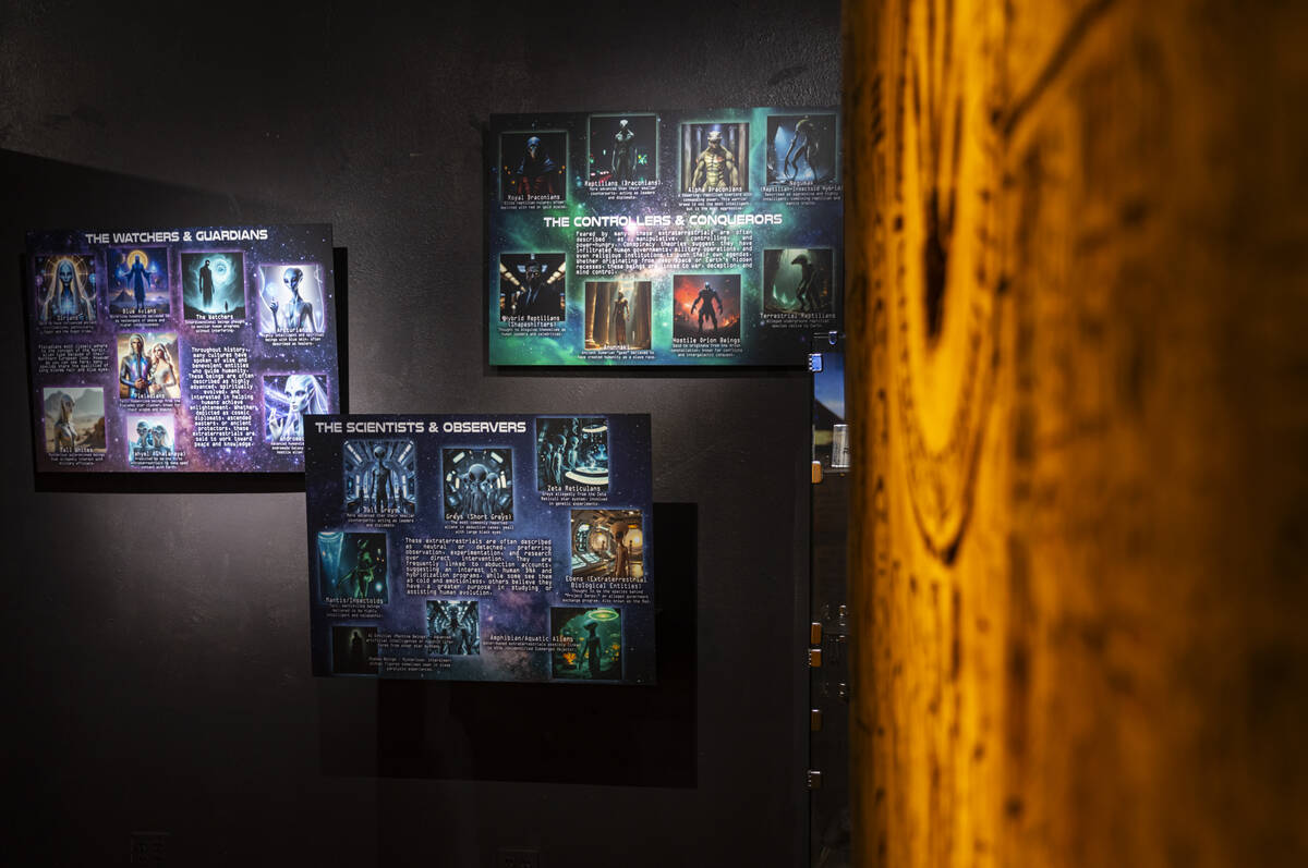 Informational displays about different types of aliens, referenced in media, literature and con ...
