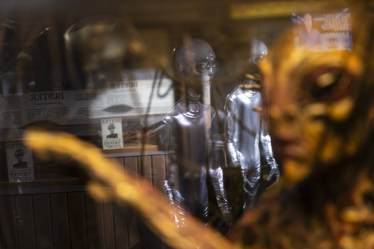 Aliens reflected in a display at the Outpost 51 Alien Museum on Tuesday, May 13, 2025, in Bould ...