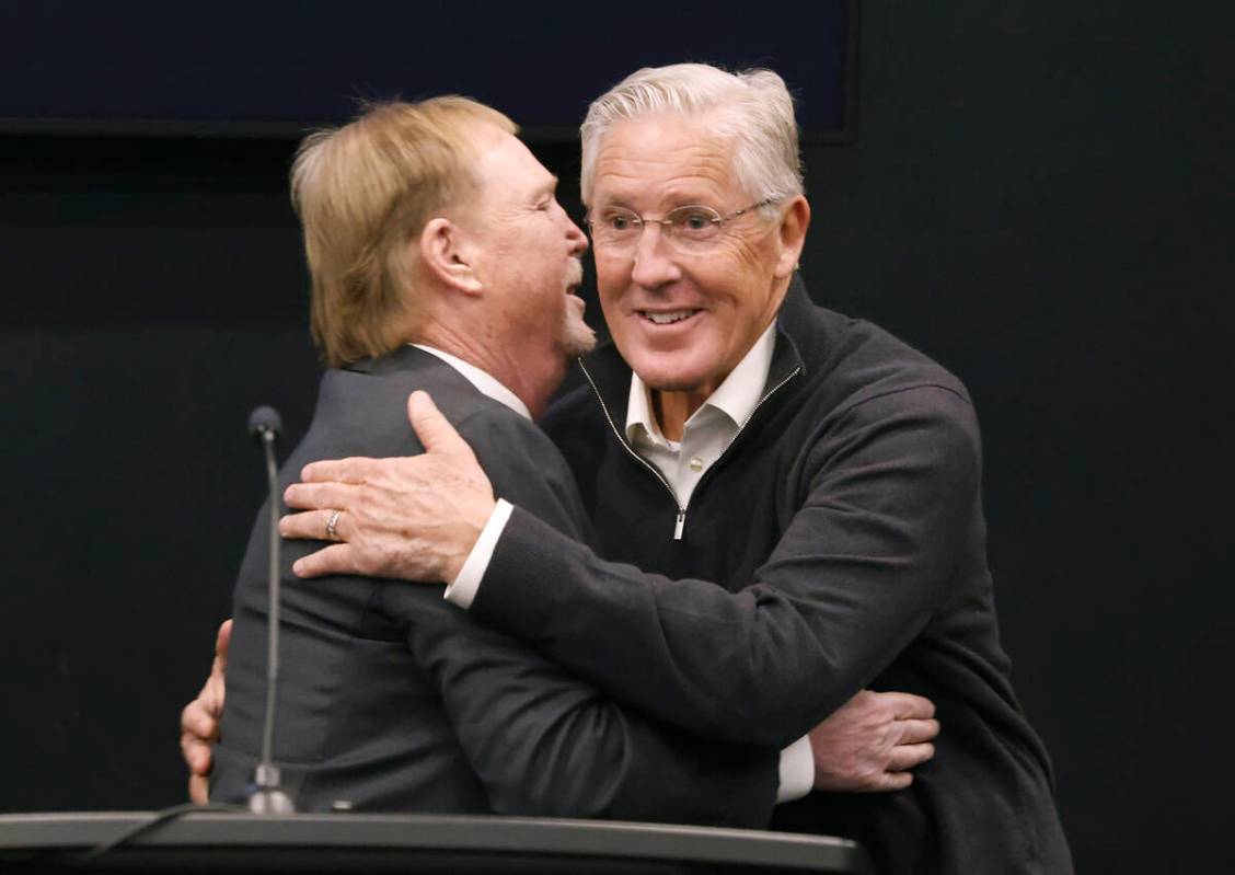 Raiders owner Mark Davis, left, greets Pete Carroll after introducing him as the new head coach ...
