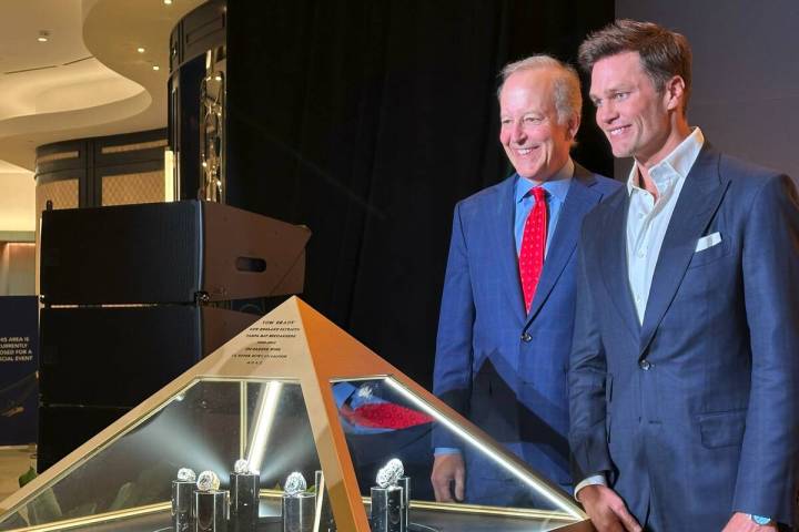 Jim Gray and Tom Brady are shown with Brady's seven Super Bowl rings at Fontainebleau's Urs Fis ...
