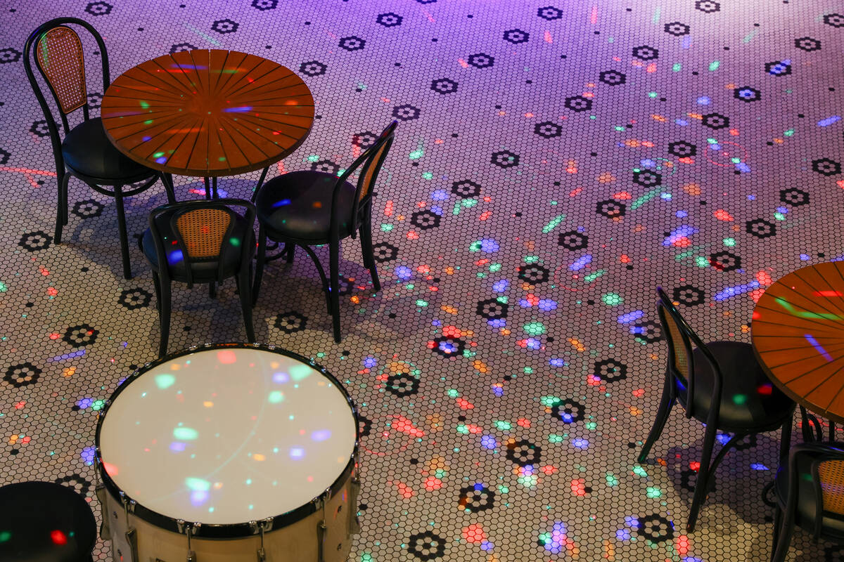 Light dances across tables on the first level of Smelly Cat, a new karaoke bar opening soon in ...