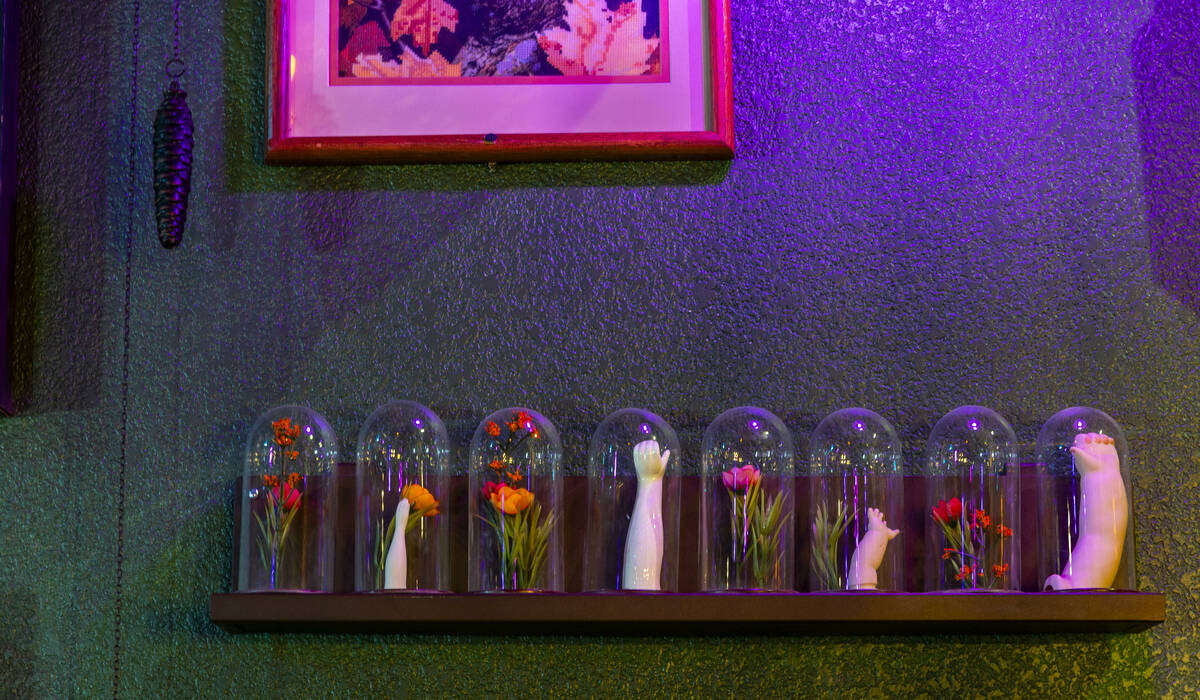 Dramatic lighting and funky art are a focus of the new Grey Witch bar and restaurant on Thursda ...