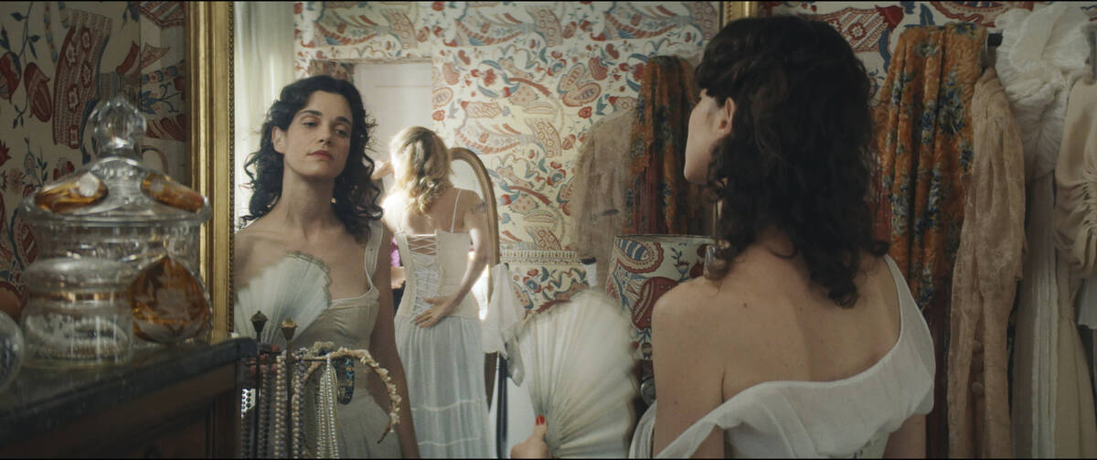 This image shows Camille Rutherford in a still from the film "Jane Austen Wrecked My Life. ...