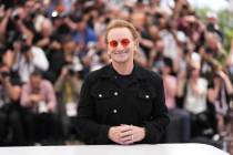 Bono poses for photographers at the photo call for the film 'Bono: Stories of Surrender' at the ...