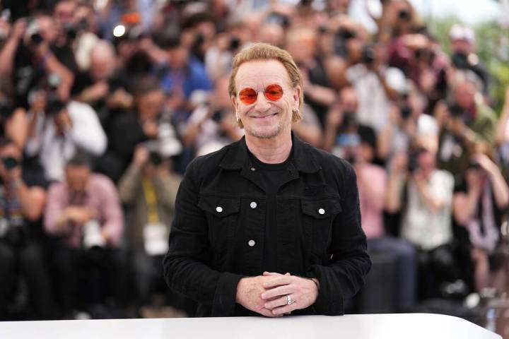 Bono poses for photographers at the photo call for the film 'Bono: Stories of Surrender' at the ...