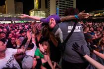 Attendees crowd surf as Cock Sparrer performs during the first day of the Punk Rock Bowling mus ...