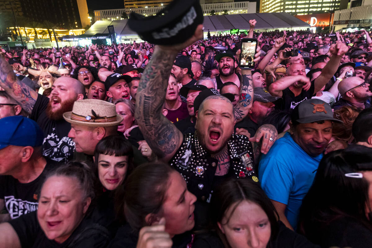 Attendees watch as Cock Sparrer performs during the first day of the Punk Rock Bowling music fe ...