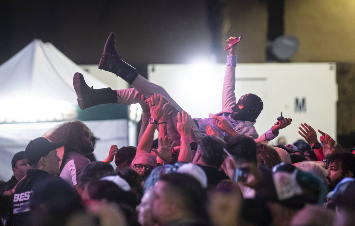 Attendees crowd surf as Power Trip performs during the first day of the Punk Rock Bowling music ...
