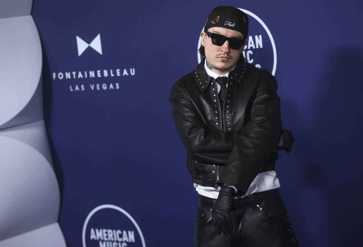 Tommy Richman poses on the red carpet for the American Music Awards at Fontainebleau on Monday, ...