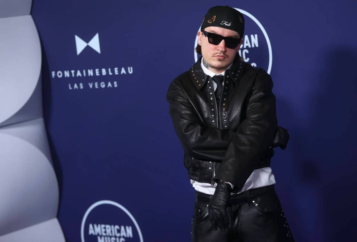 Tommy Richman poses on the red carpet for the American Music Awards at Fontainebleau on Monday, ...