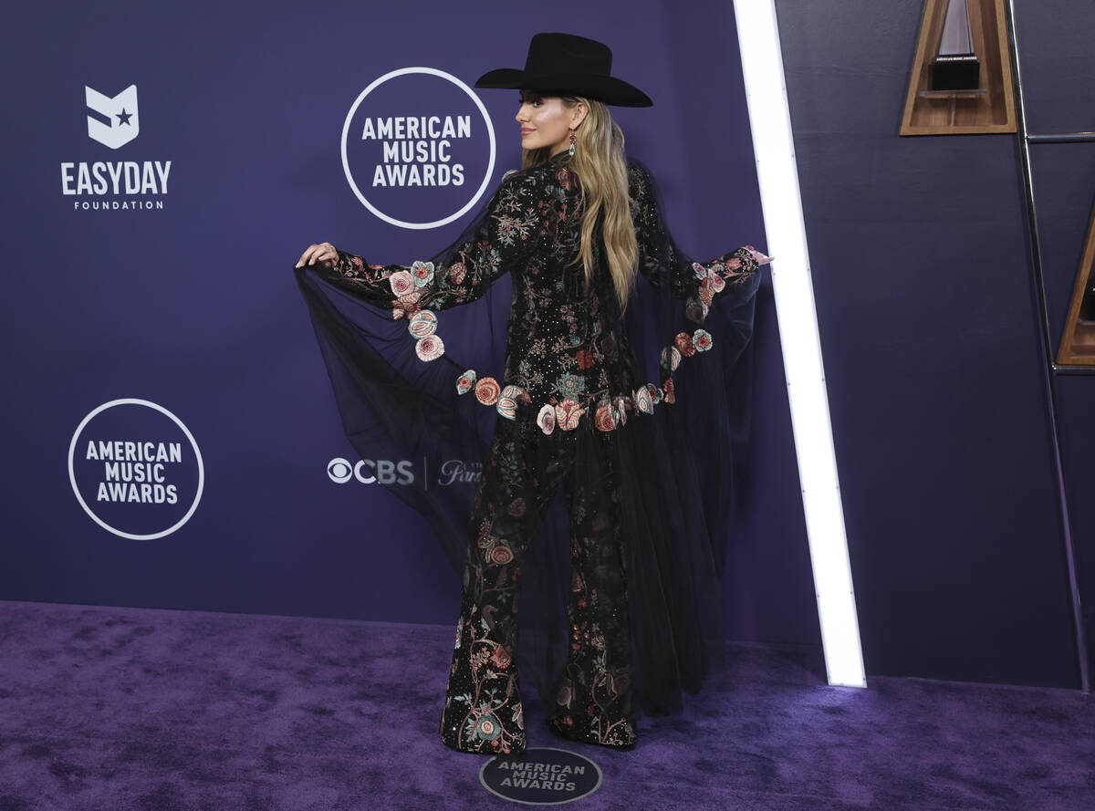Lainey Wilson poses on the red carpet for the American Music Awards at Fontainebleau on Monday, ...