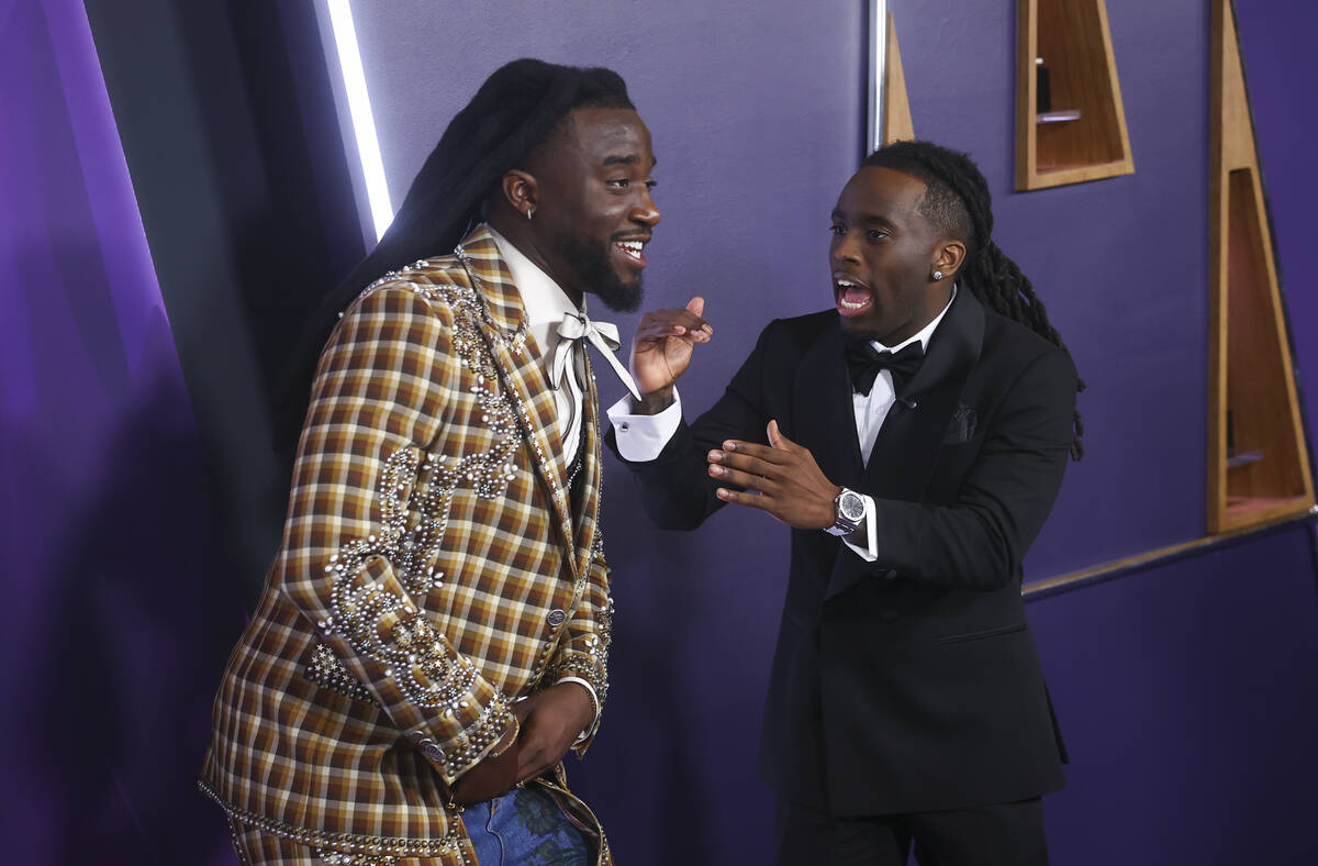 Shaboozey, left, poses with Kai Cenat on the red carpet for the American Music Awards at Fontai ...