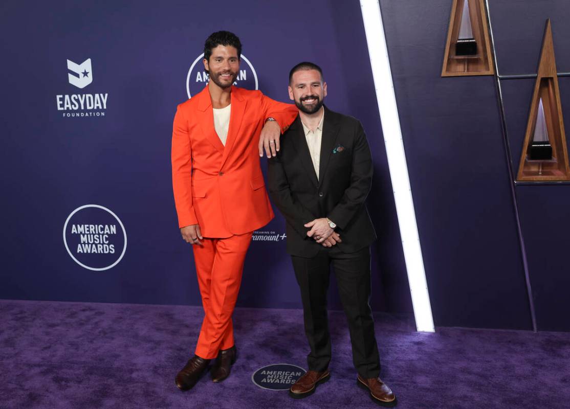 Dan + Shay pose on the red carpet for the American Music Awards at Fontainebleau on Monday, May ...