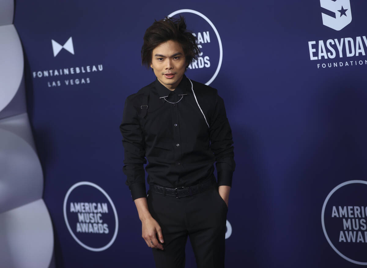 Magician Shin Lim poses on the red carpet for the American Music Awards at Fontainebleau on Mon ...