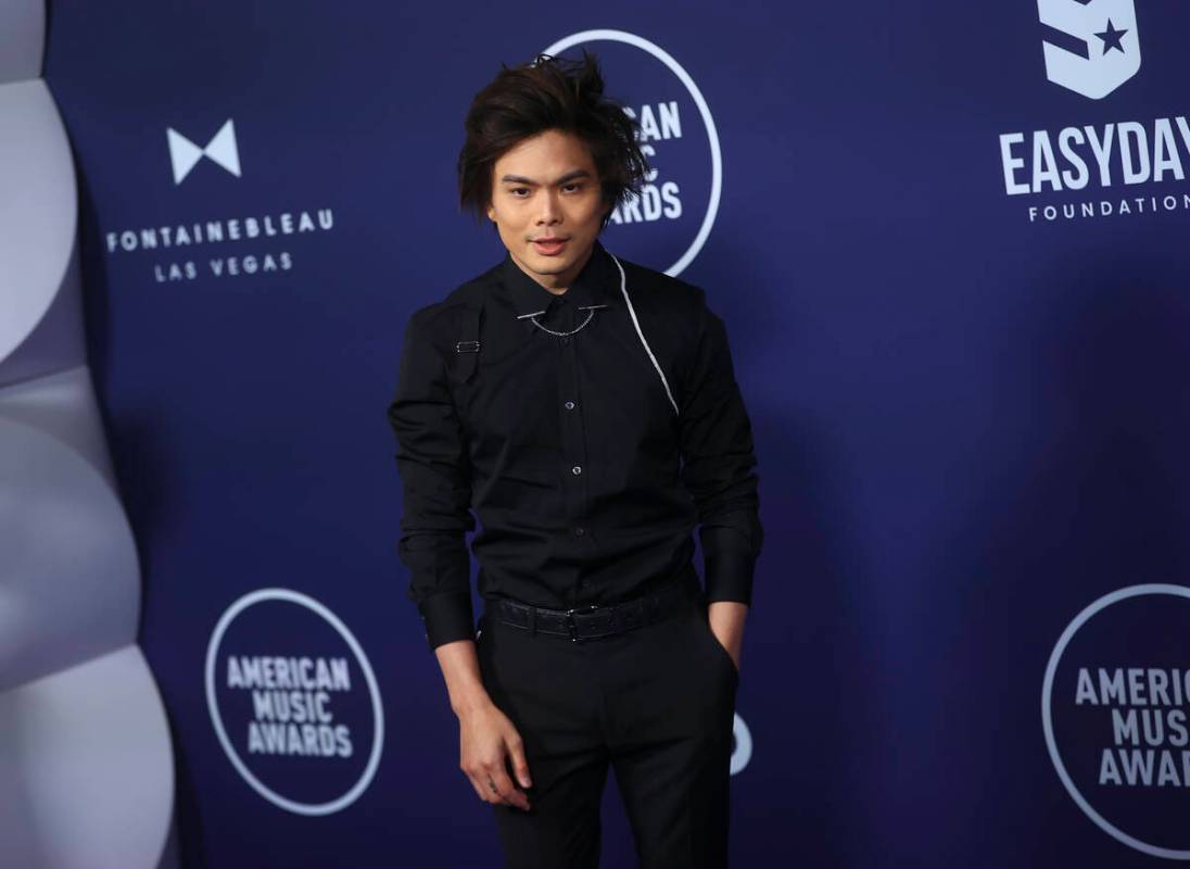 Magician Shin Lim poses on the red carpet for the American Music Awards at Fontainebleau on Mon ...