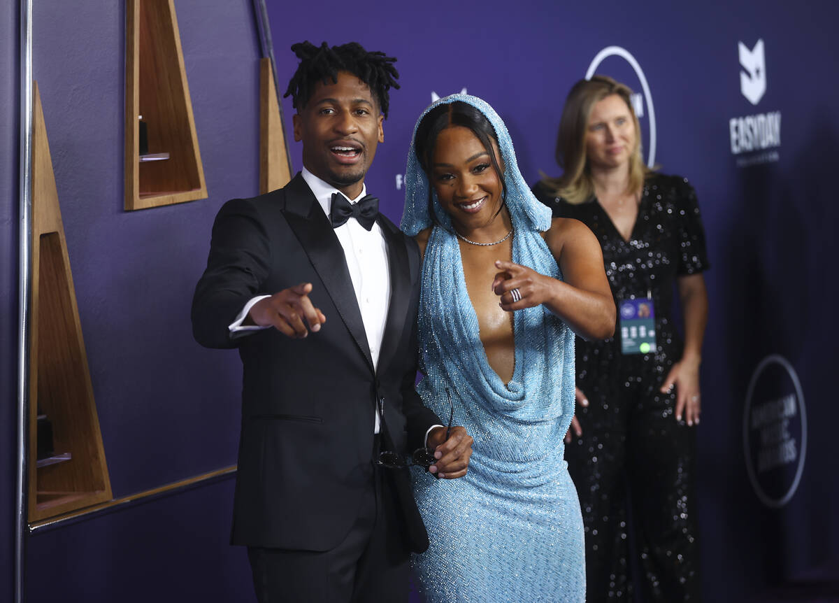 Jon Batiste and Tiffany Haddish pose on the red carpet for the American Music Awards at Fontain ...