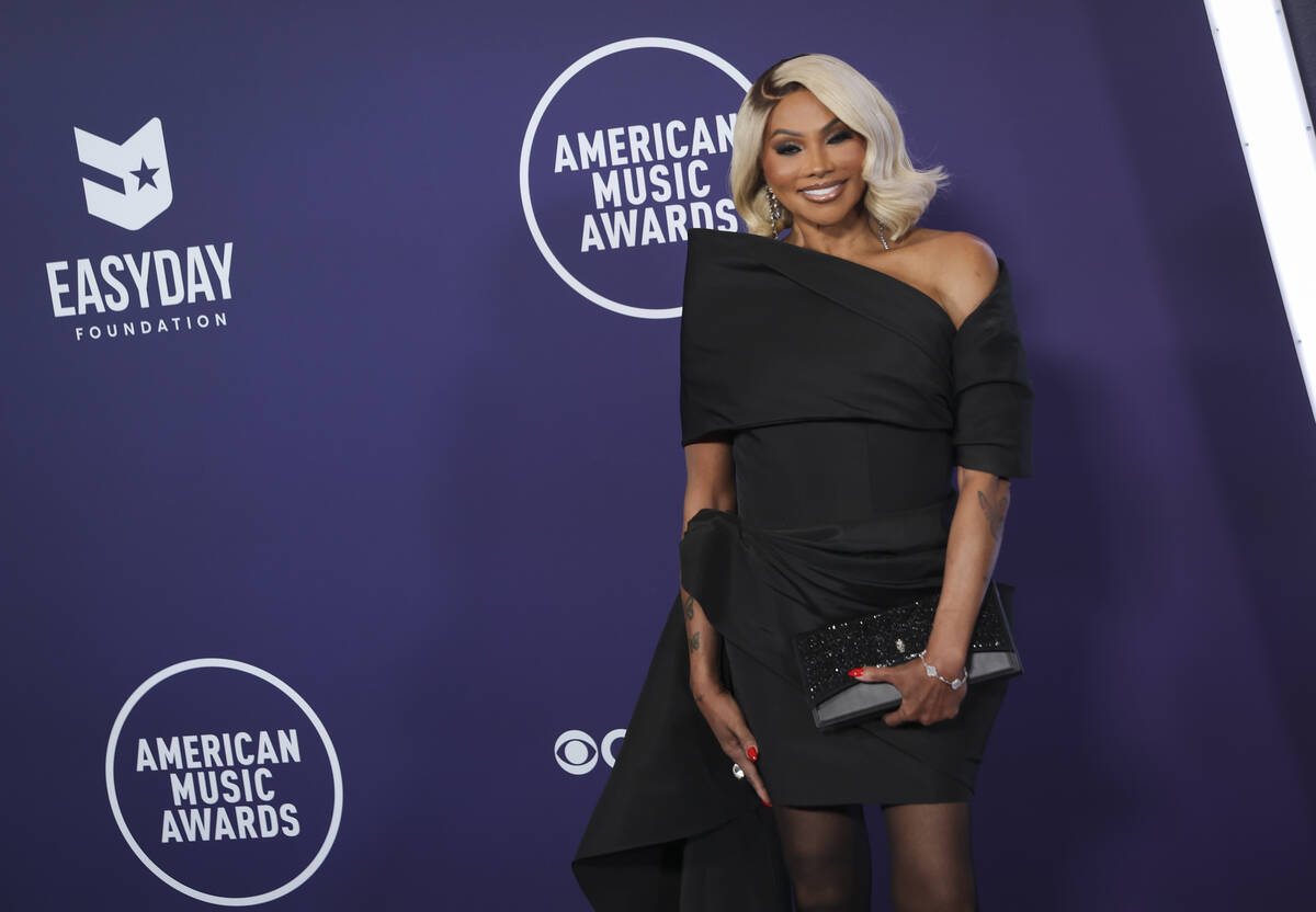Pepa of Salt-N-Pepa poses on the red carpet for the American Music Awards at Fontainebleau on M ...