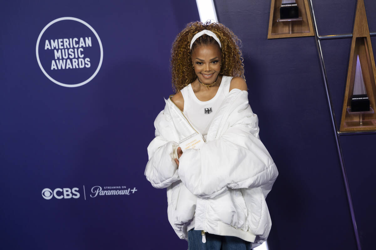 Janet Jackson poses with the Icon Award at the American Music Awards at Fontainebleau on Monday ...