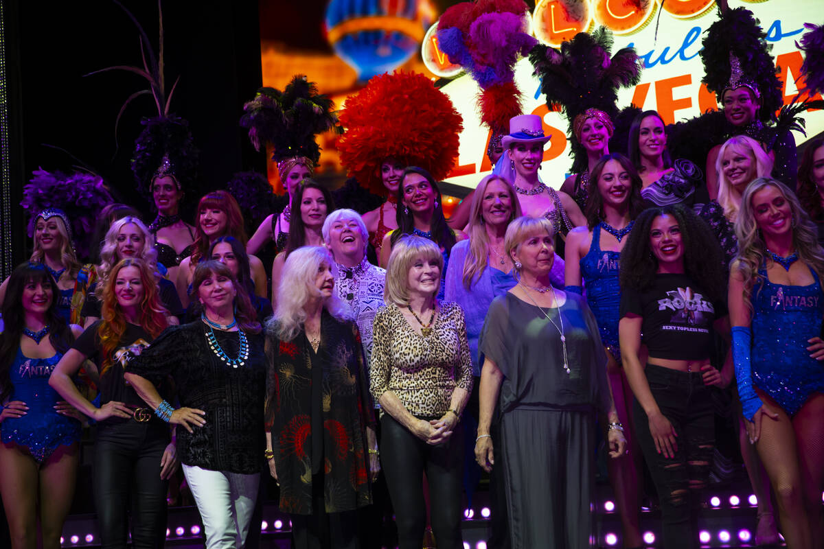 Las Vegas showgirls of past and present listen as John Katsilometes, out of frame, talks about ...