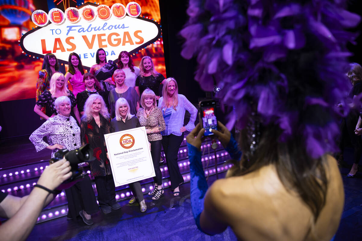 Las Vegas showgirls of past and present poses for photos during an event to celebrate the first ...