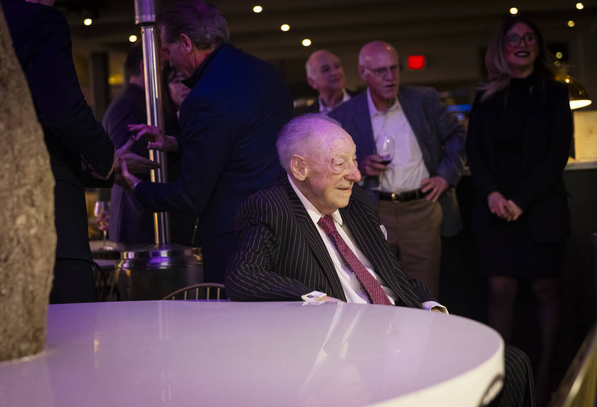 Former Las Vegas Mayor Oscar Goodman looks at a newly created mural of himself with wife and fo ...