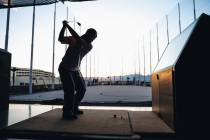 Golfers try out the bays at Atomic Golf on Wednesday, March 20, 2024, in Las Vegas. (Madeline C ...