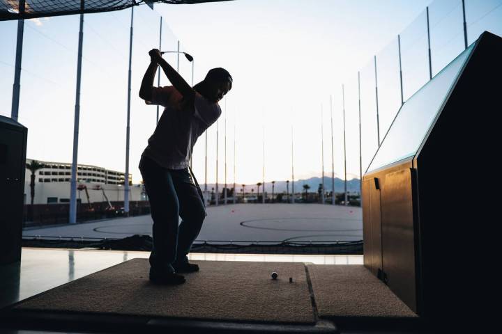 Golfers try out the bays at Atomic Golf on Wednesday, March 20, 2024, in Las Vegas. (Madeline C ...