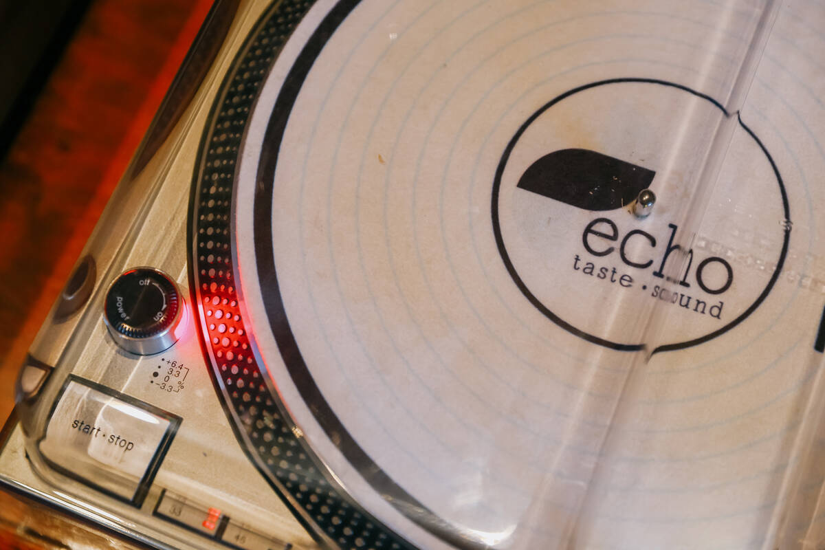 A turntable emblazoned with the restaurant’s logo sits on a table at Echo Sound and Tast ...